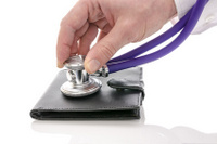Male hand checking a wallet with stethoscope
